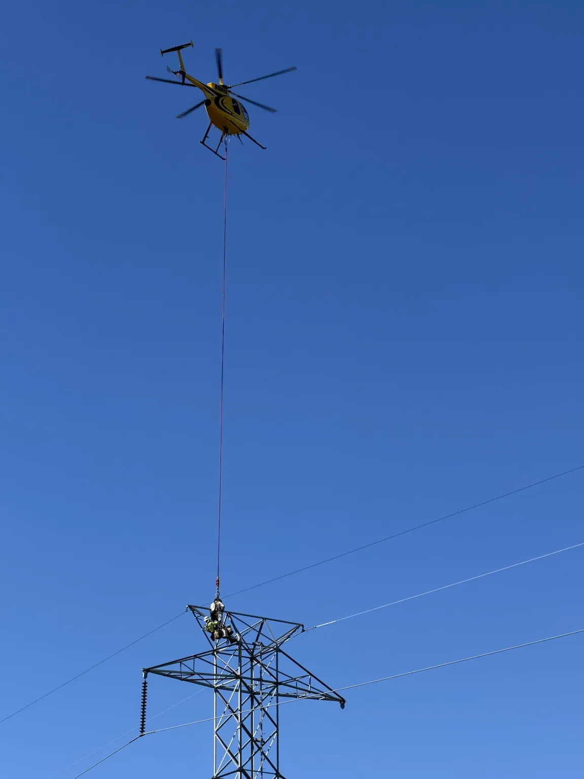 Helicopter supporting high-voltage transmission line work